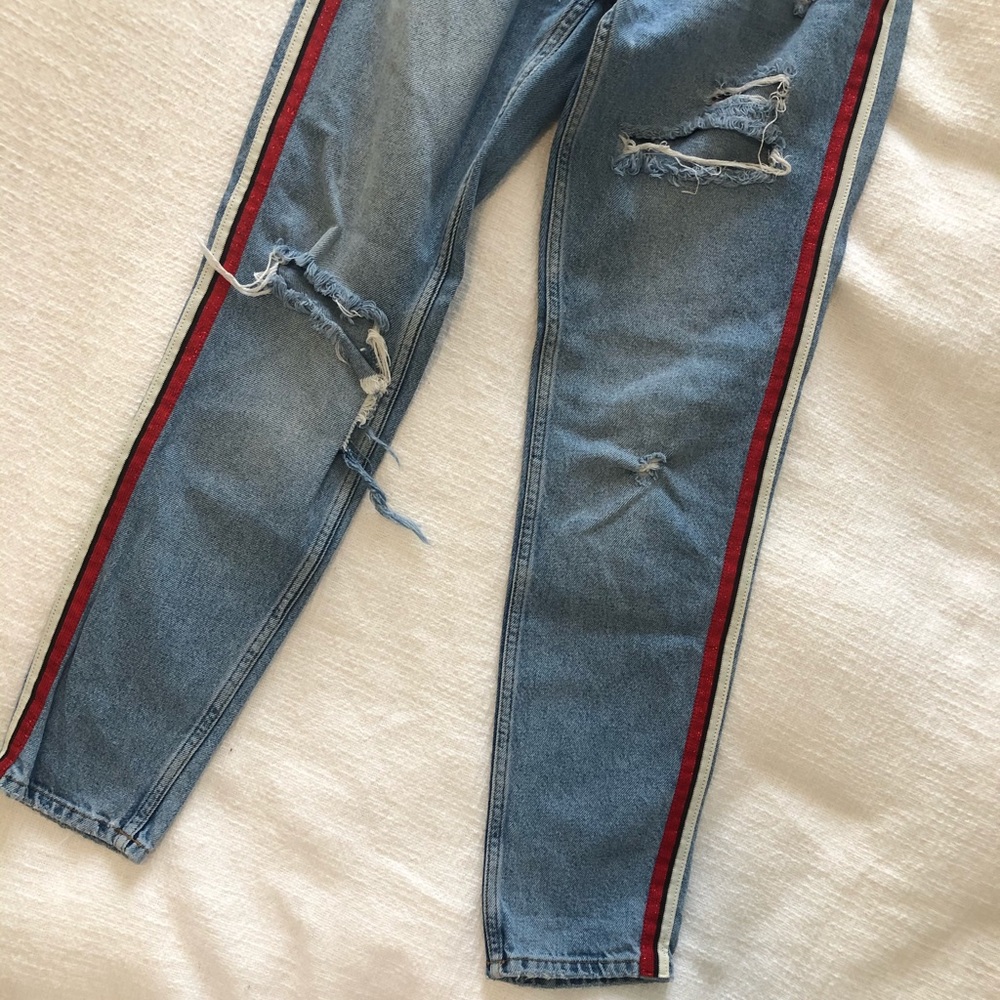 Statement + holy denim jeans